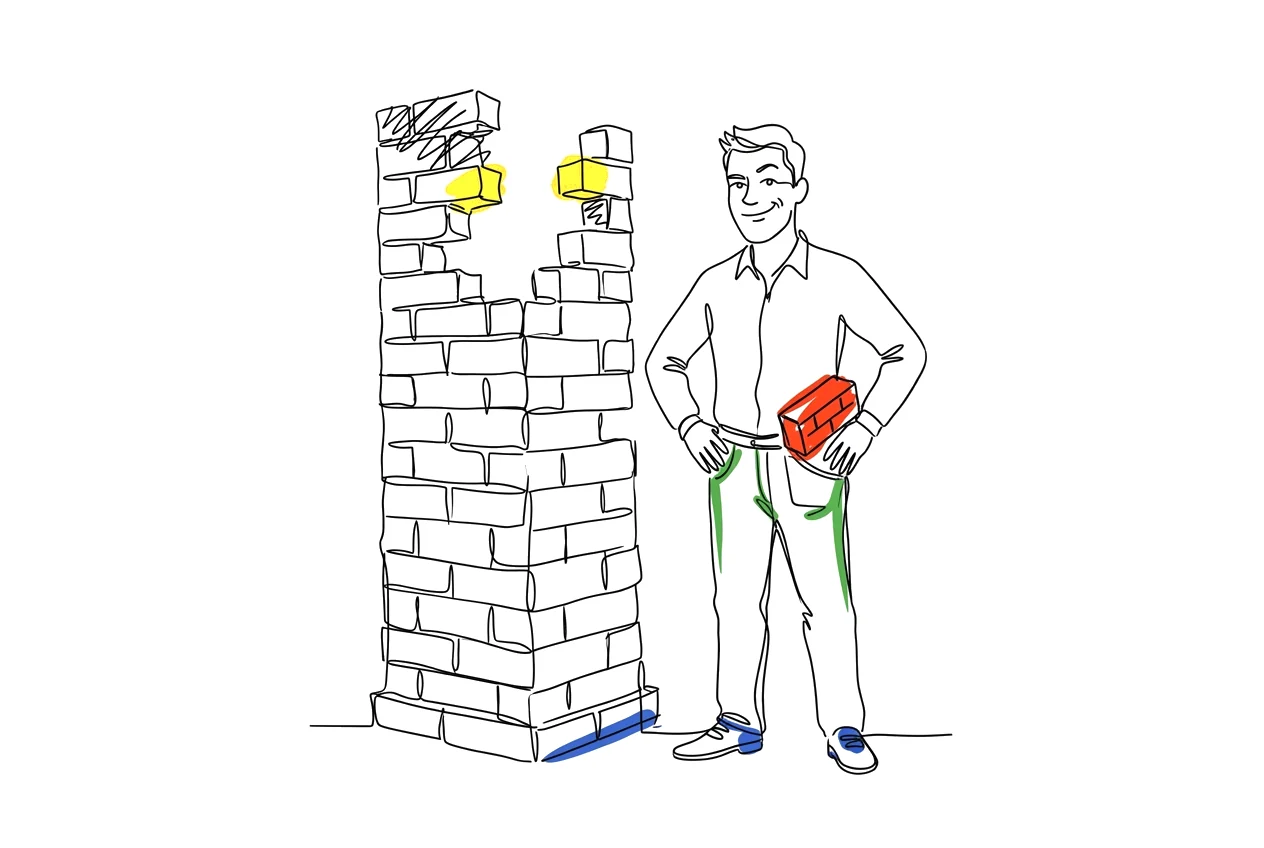 Man naast een bijna afgebouwde muur, de laatste steen onder zijn arm